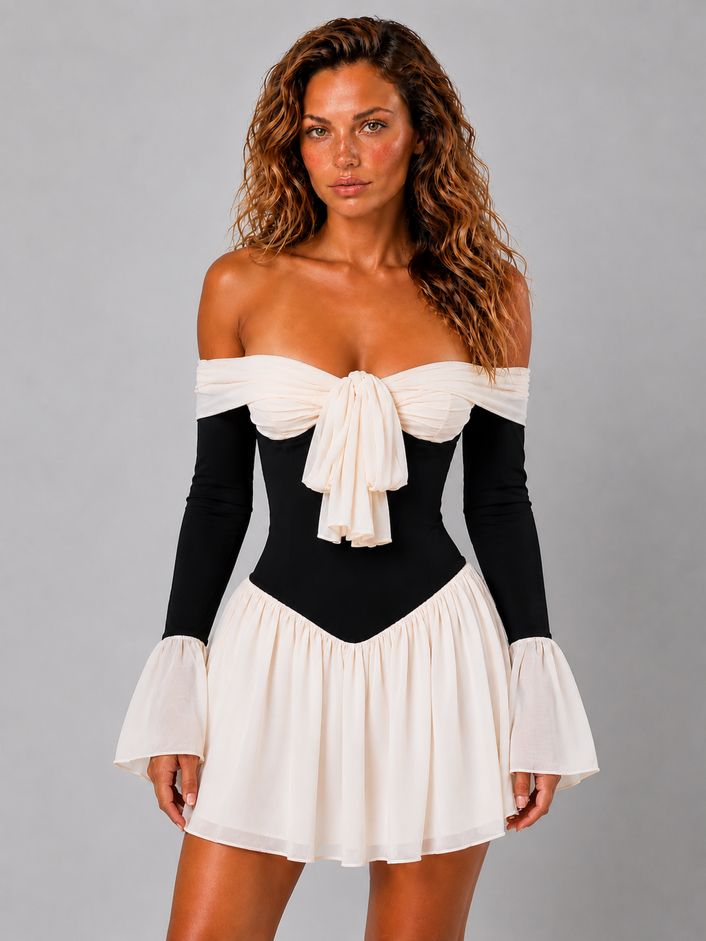 Lunoria | Off-Shoulder Mini Jurk met Statement Strik en Geplooide Rok
